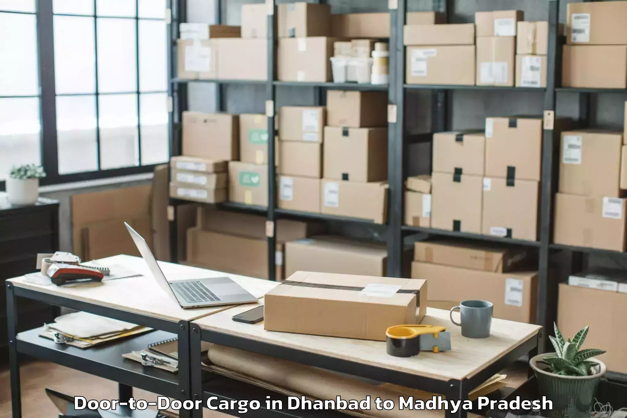 Get Dhanbad to Bhanpur Door To Door Cargo